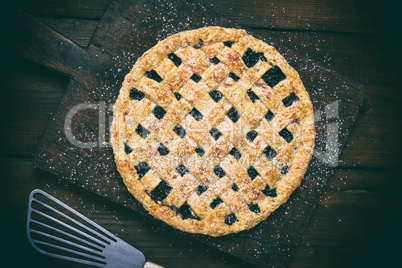 baked round black currant cake