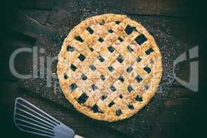 baked round black currant cake