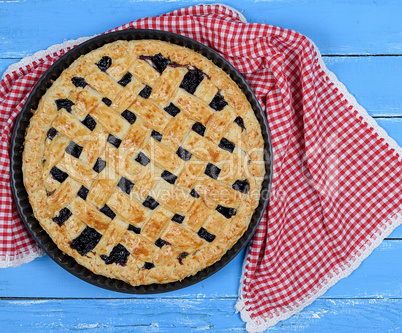 round baked fruit cake on red textile napkin