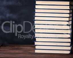 large stack of books in a blue cover