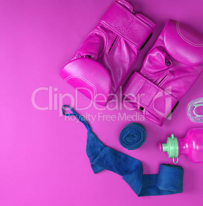 leather pink boxing gloves, a blue textile bandage