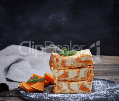 square pieces of cheesecake with pumpkin