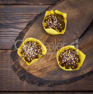 Banana muffin with chocolate wrapped in yellow paper
