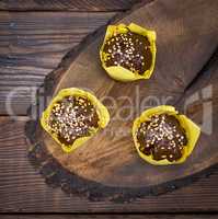 Banana muffin with chocolate wrapped in yellow paper