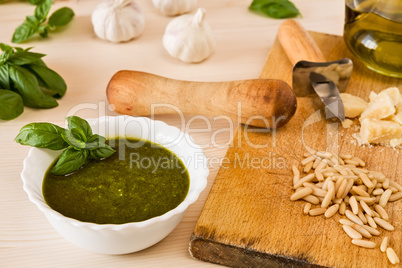 Closeup of pesto genovese with its ingredients