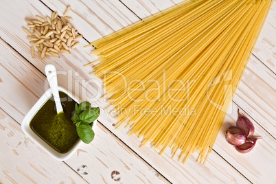 Pesto genovese and linguine pasta, pine nuts and garlic on a tab