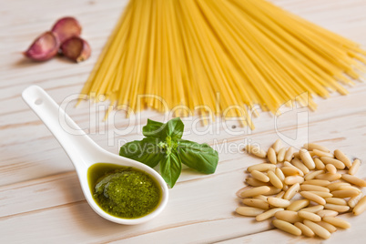 Closeup of pesto genovese sauce and linguine pasta, pine nuts an