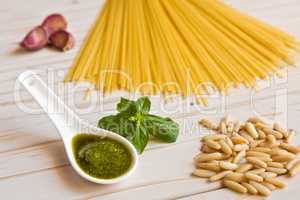 Closeup of pesto genovese sauce and linguine pasta, pine nuts an