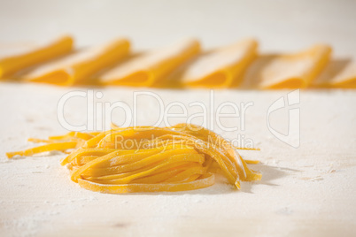 Closeup of fresh uncooked tagliatelle pasta