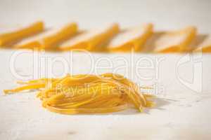 Closeup of fresh uncooked tagliatelle pasta