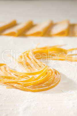 Fresh uncooked tagliatelle pasta