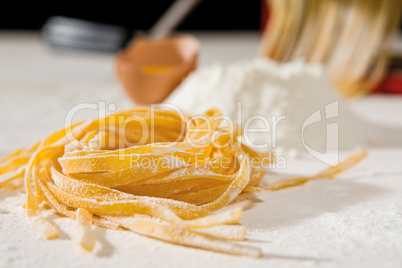 Closeup of tagliatelle pasta and its ingredients
