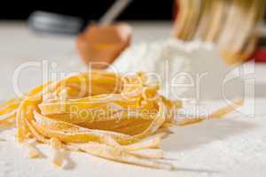 Closeup of tagliatelle pasta and its ingredients