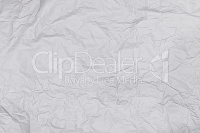 Background or pattern of wrinkled white rectangular paper with soft texture