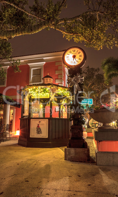 Concierge gazebo kiosk with Christmas lights and a clock as sunr