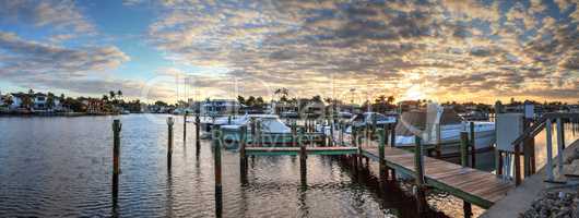 Harbor with boats at golden hour as day breaks over the North Gu