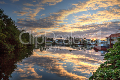 Harbor with boats at golden hour as day breaks over the North Gu