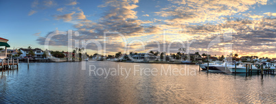 Harbor with boats at golden hour as day breaks over the North Gu