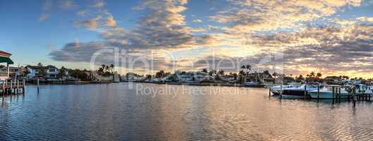 Harbor with boats at golden hour as day breaks over the North Gu