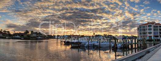 Harbor with boats at golden hour as day breaks over the North Gu