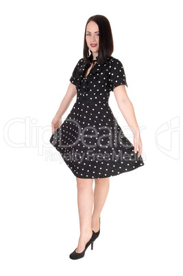 Beautiful woman standing in a pock dot dress