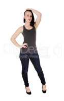 Woman with fancy hair standing in jeans