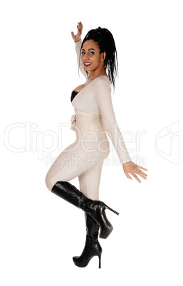 Woman dancing in silver jumpsuit