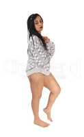 Pretty woman standing bare feet in a sweater