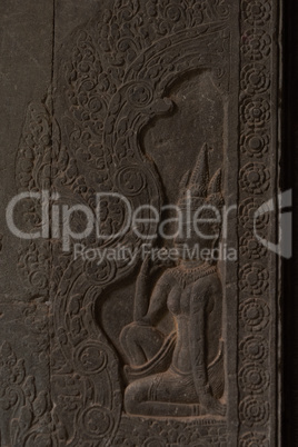 Bas-relief of seated woman in Angkor Wat