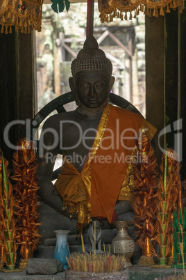 Buddha statue in temple dressed in orange