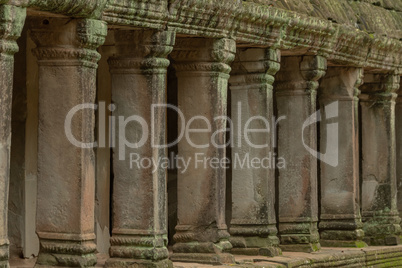 Colonnade of stone pillars in temple ruins