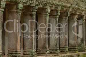 Colonnade of stone pillars in temple ruins