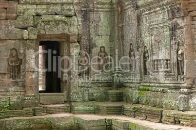 Decorated entrance and bas-reliefs in stone temple