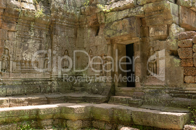 Doorway in temple wall decorated with figures