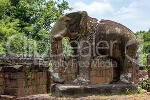 Elephant statue at corner of ruined temple