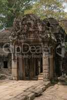 Entrance to ruined temple with decorated portico