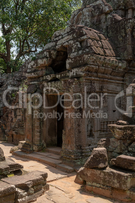 Entrance to stone temple with holed roof