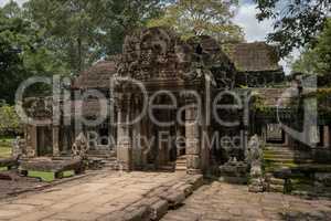 Facade of Banteay Kdei temple in trees