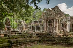 Facade of temple ruins framed by trees