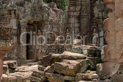 Fallen blocks block courtyard by temple doorway