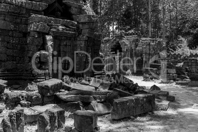 Mono fallen stone blocks litter temple grounds