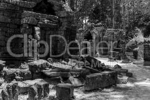 Mono fallen stone blocks litter temple grounds