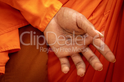 Phone number on hand of Buddhist monk