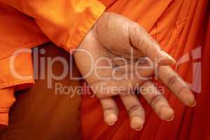 Phone number on hand of Buddhist monk