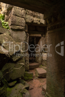 Pile of rocks beside corridor in temple