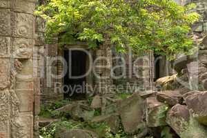 Pile of rocks beside two temple doorways