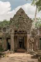 Portico of Preah Khan temple in trees