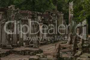Ruined columns of Bayon temple in forest