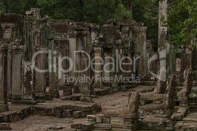 Ruined columns of Bayon temple in jungle