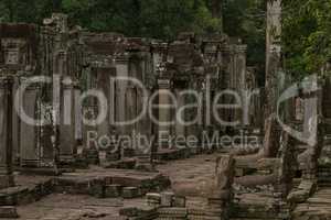 Ruined columns of Bayon temple in jungle
